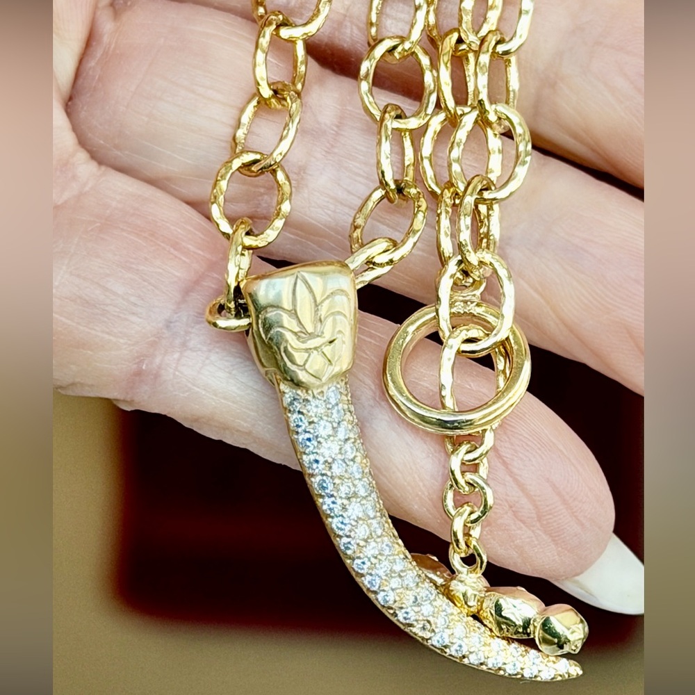 Sold.    
18k gold and diamond Necklace